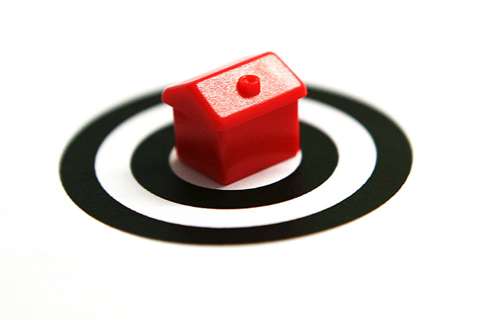 House on black target signifying the danger from property fraudsters.