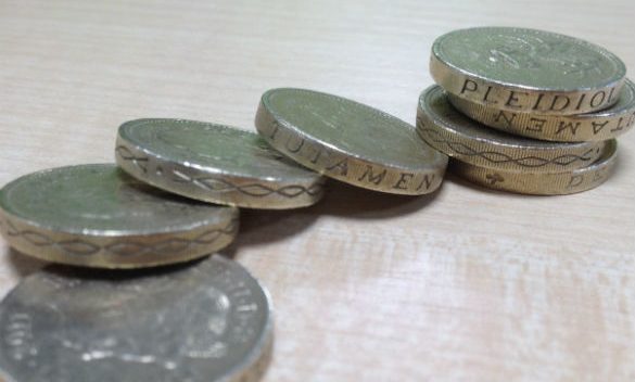 Pound coins piled up on top of each other.