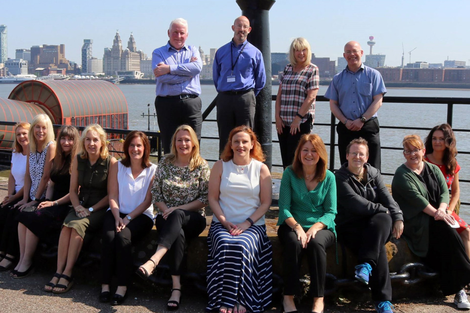 Our Data Services Team pictured by the Mersey river in Birkenhead