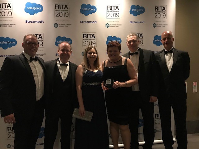 Team members from HM Land Registry and Kainos with their trophy at the Real IT Awards