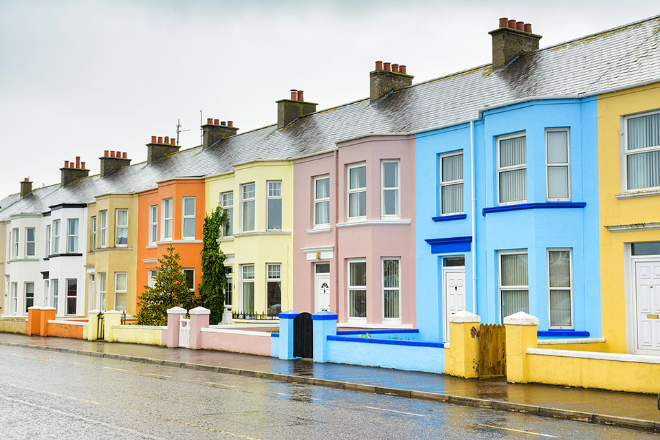 Row of terraced houses with each painted a different colour.