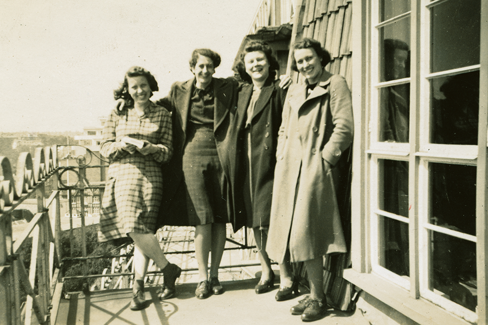 Four female colleagues taking a break on a balcony at Marsham Court in Bournemouth, HM Land Registry's wartime home, in 1941.