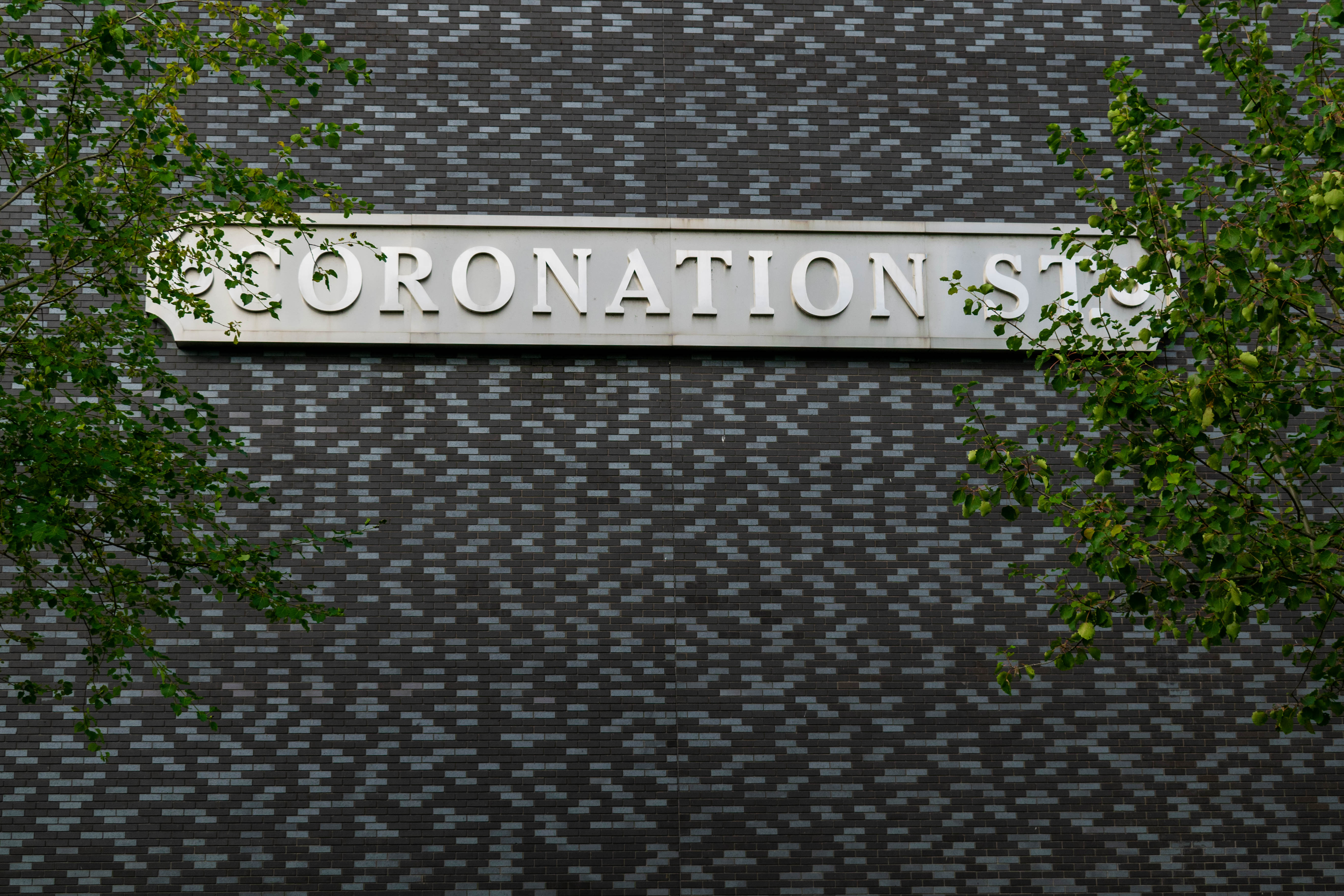 Street sign saying 'Coronation Street'.