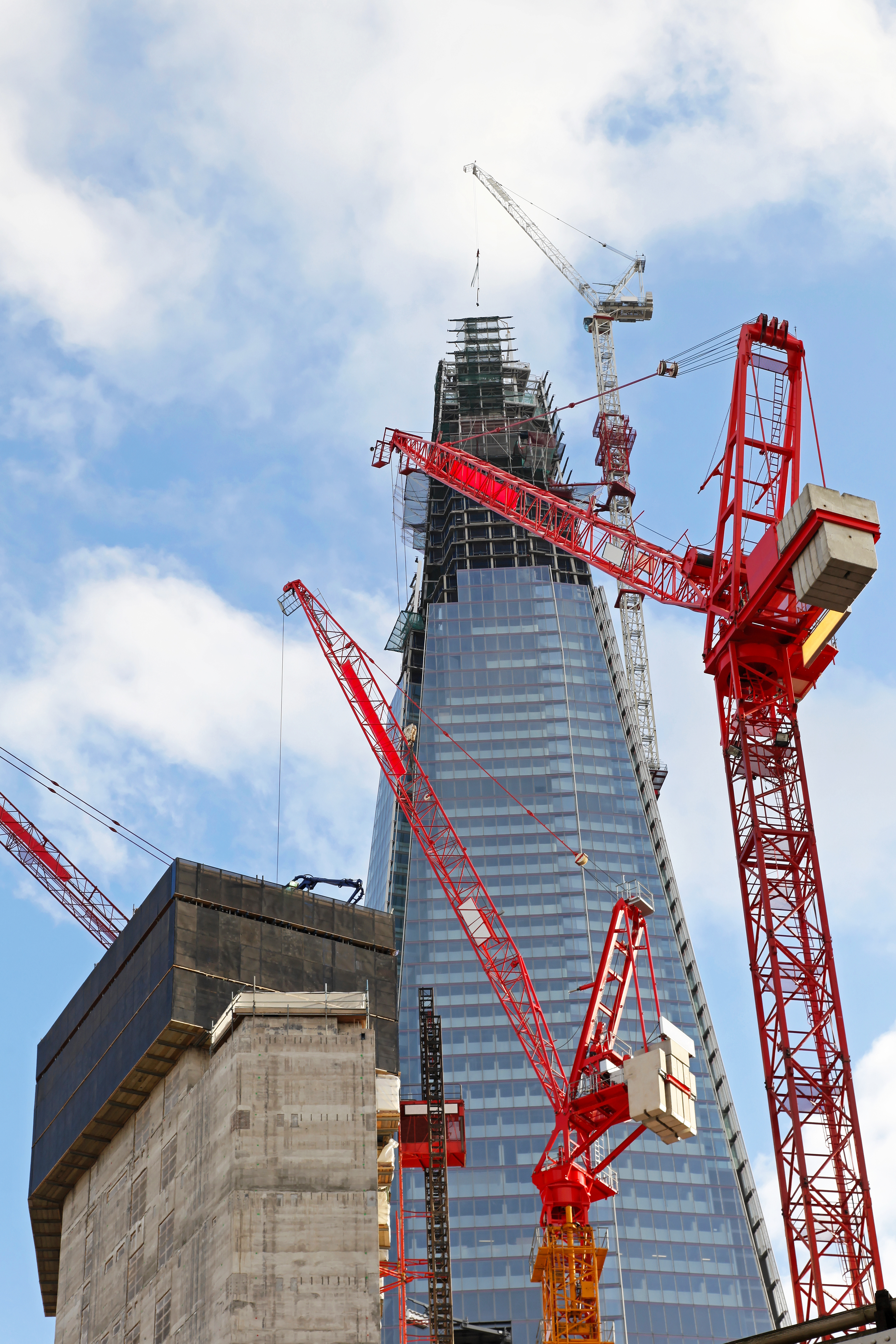 Red cranes at The Shard construction site. London