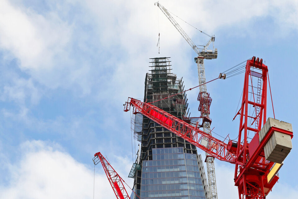 Red cranes at The Shard construction site, London