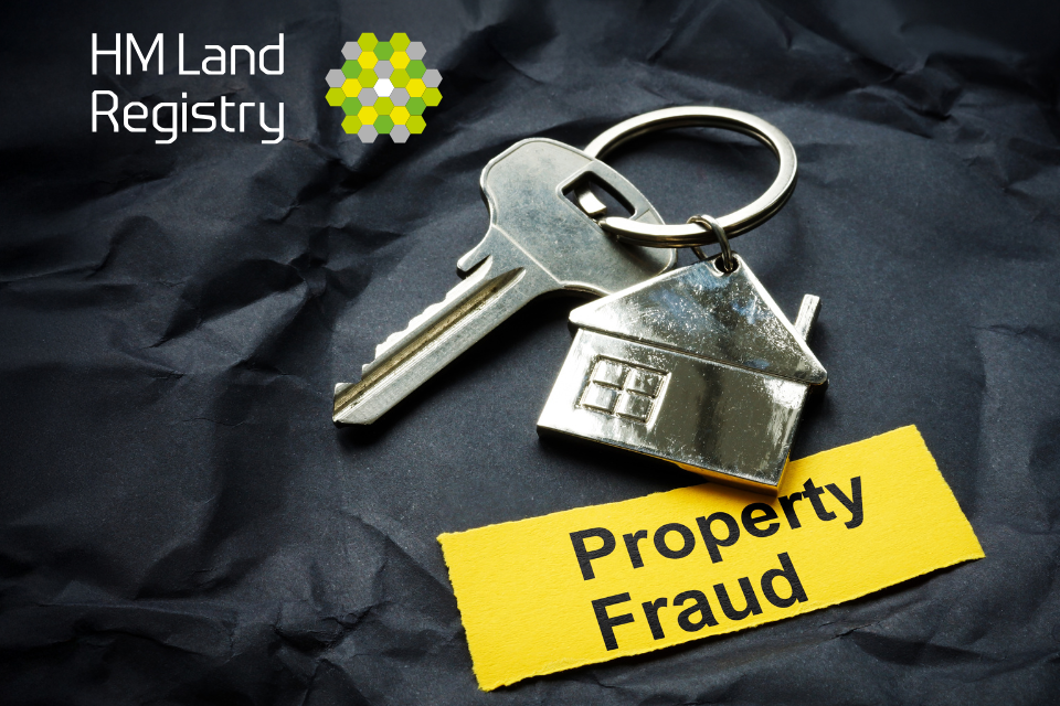 Keyring with a house and the word Property Fraud written on a yellow background.