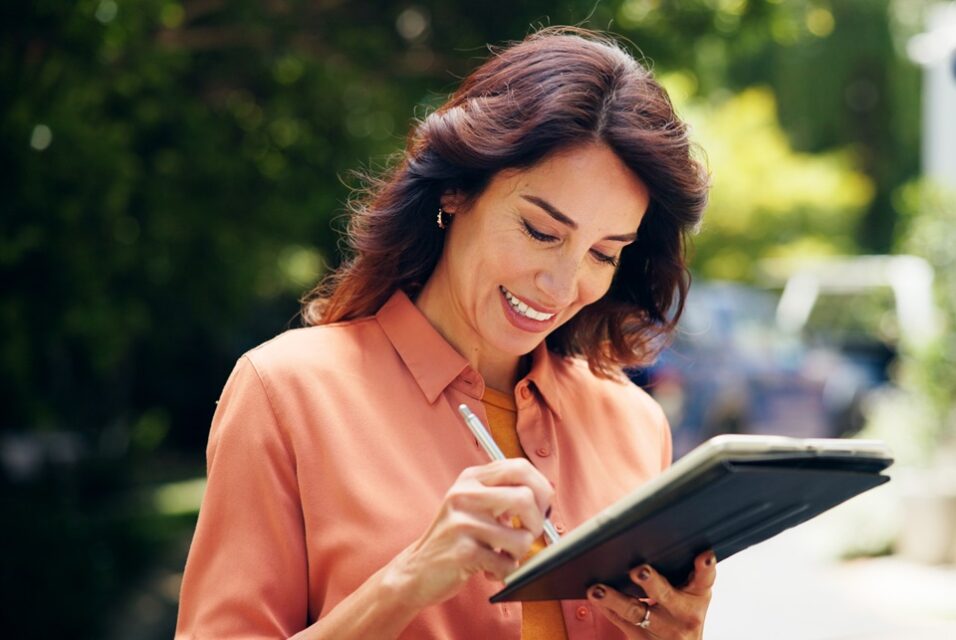 Woman signing electronically for a service.