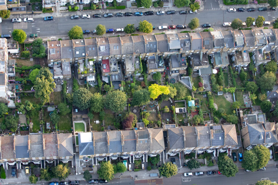 An aerial photograph of two rows of terraced houses.
